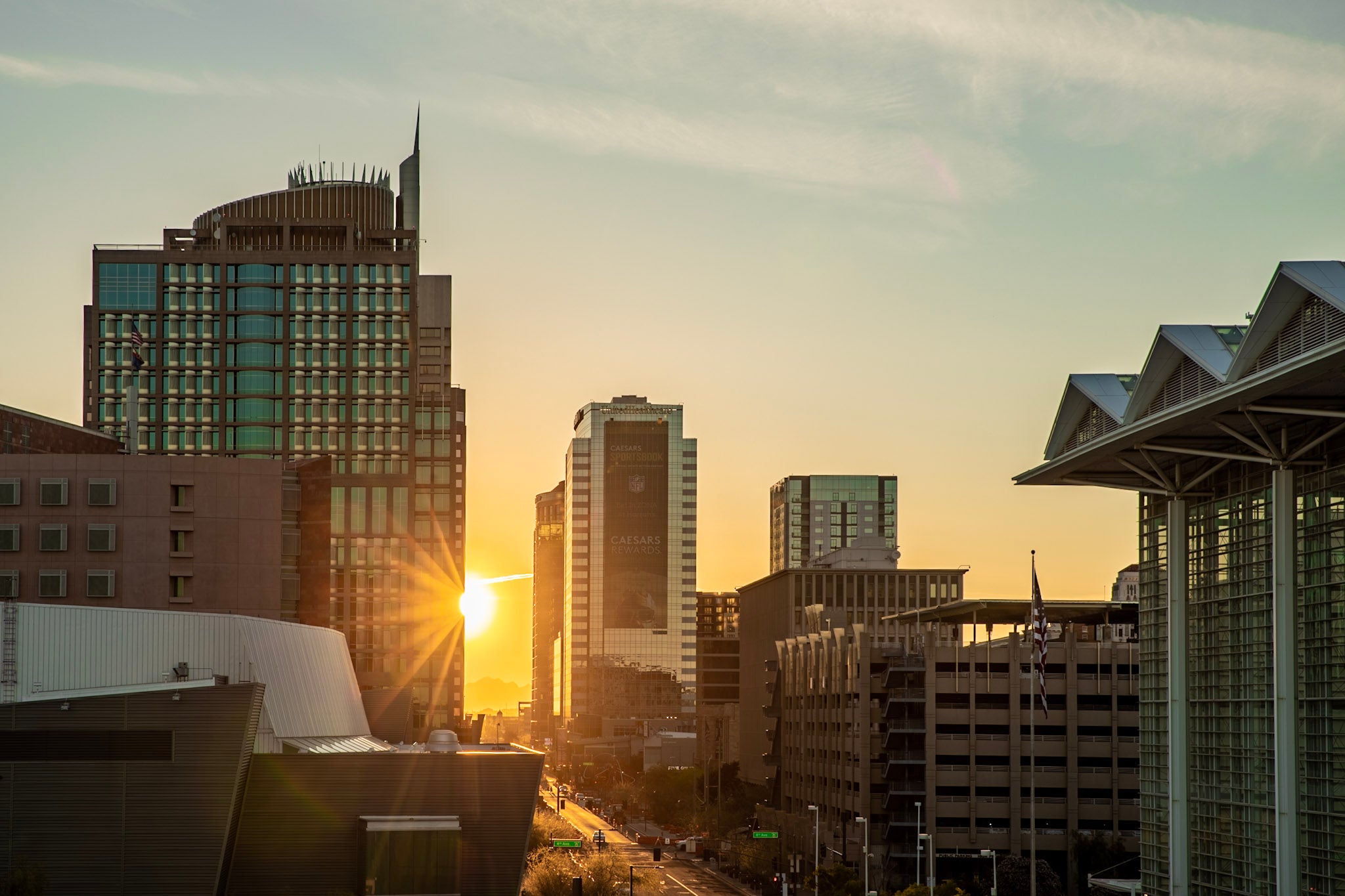 The sun rising over downtown Phoenix.
