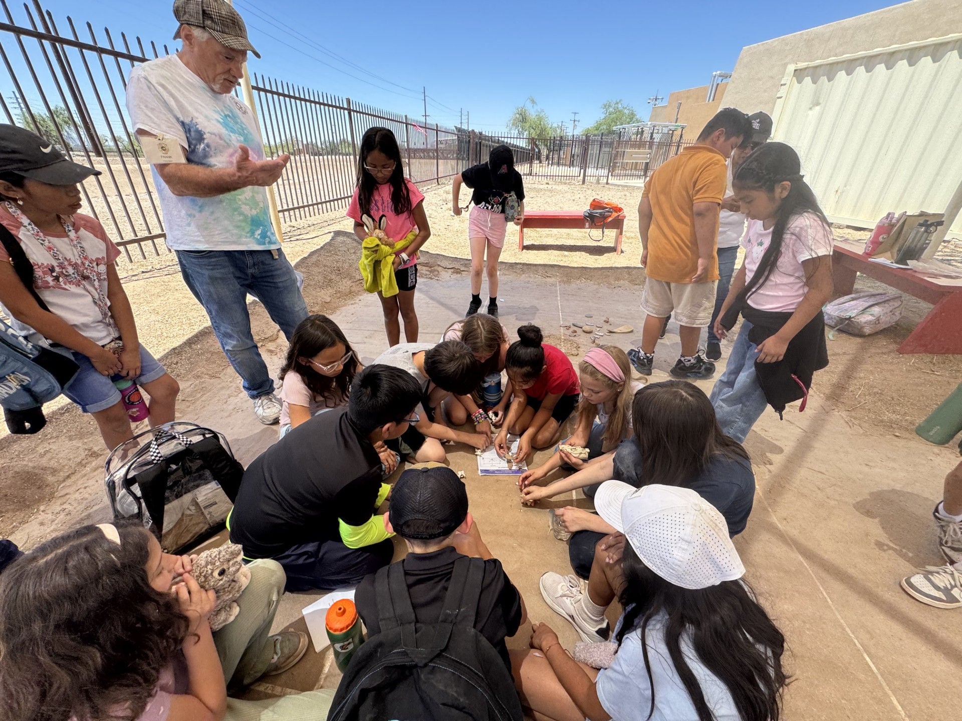 Children and adults participating in Detective Archaeology activity during International Archaeology Day