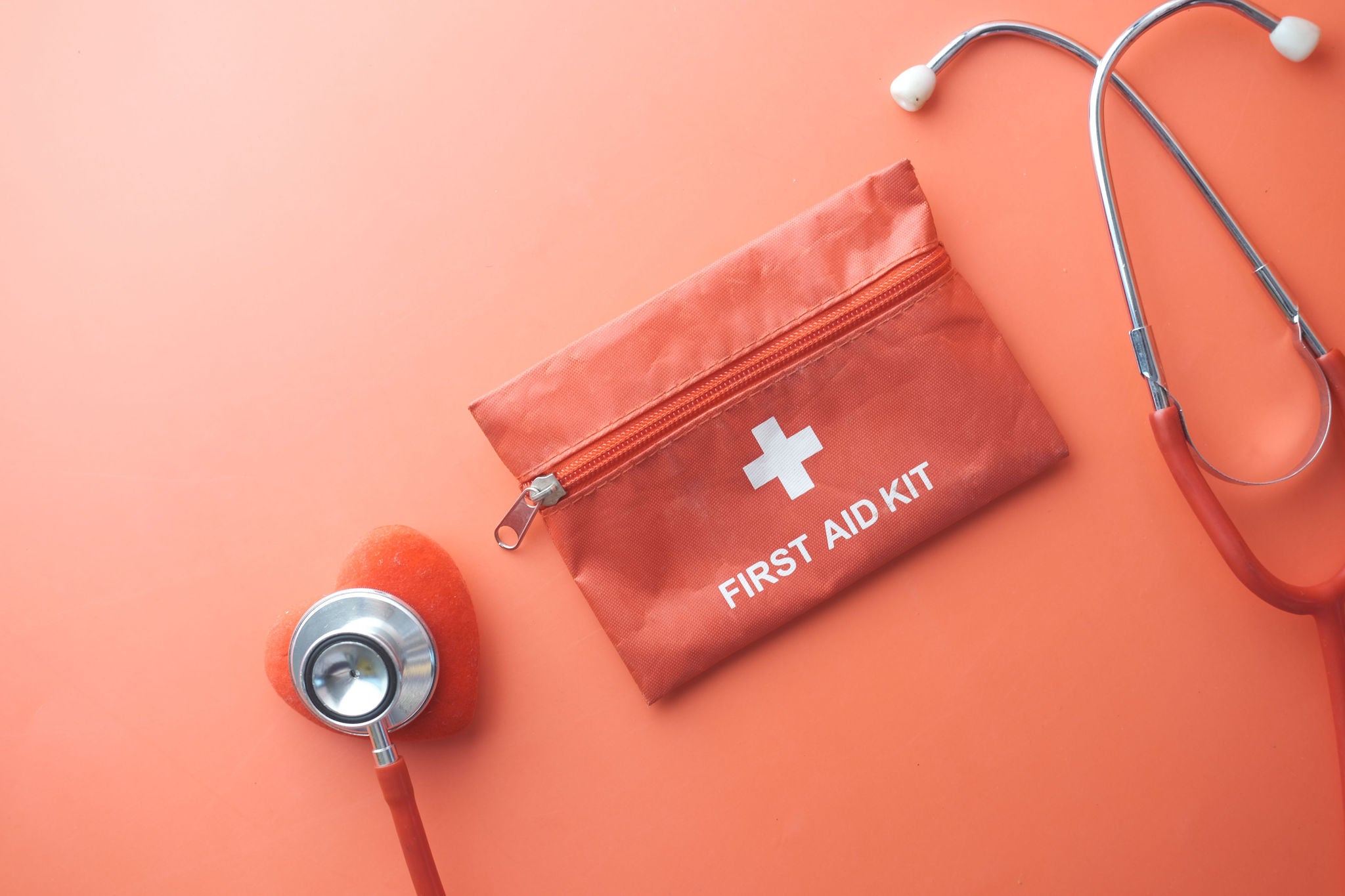An image showing a stethoscope and first aid kit
