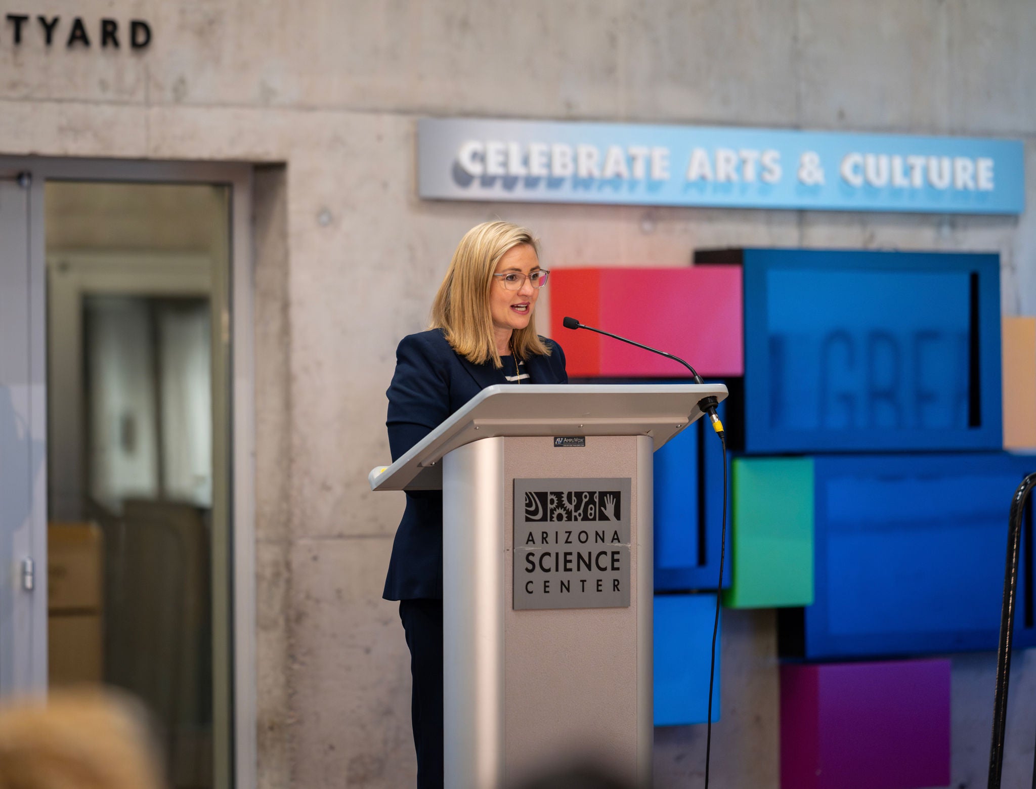 Phoenix Mayor Kate Gallego speaks from the podium at the Arizona Science Center.