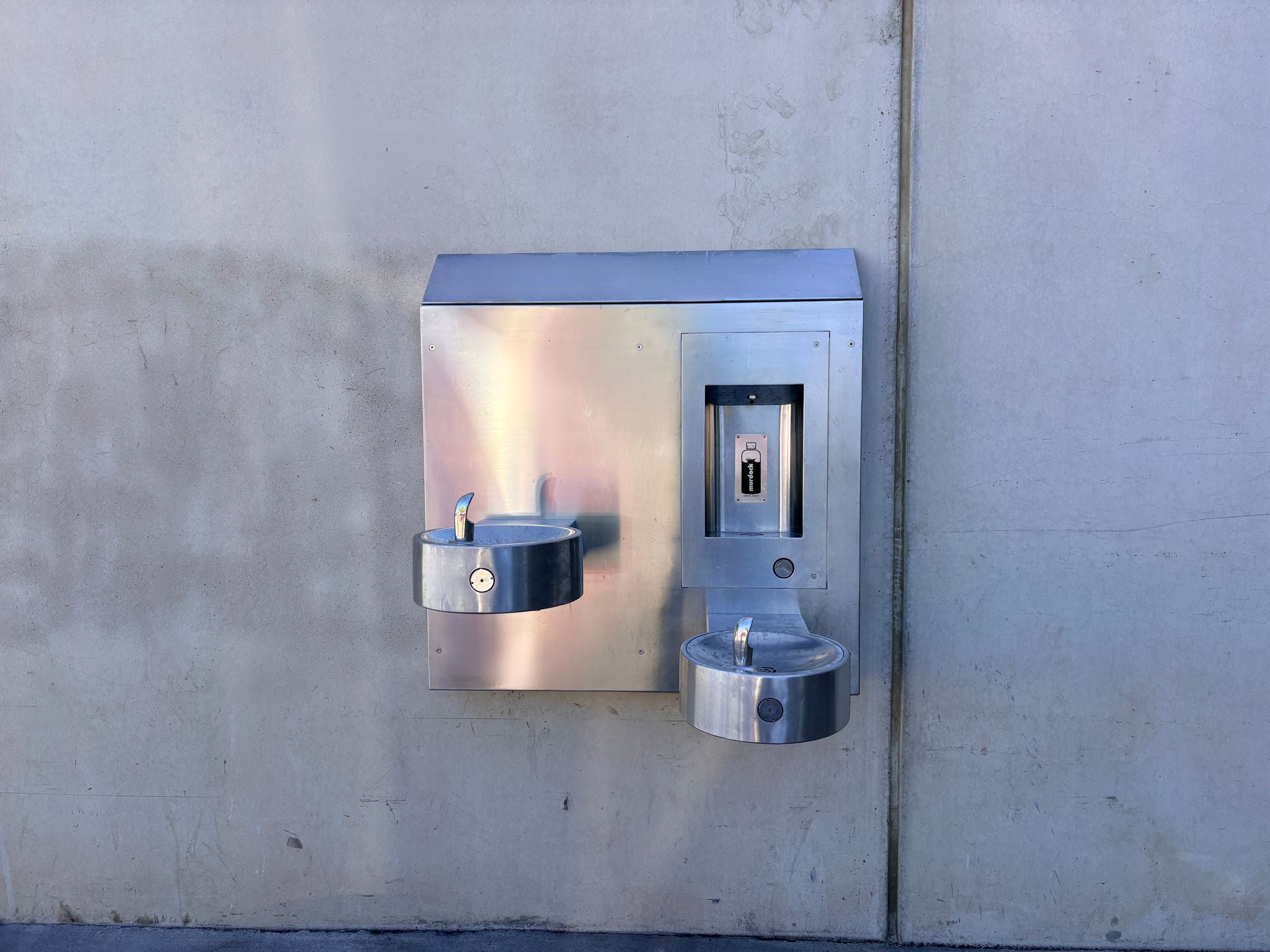 Photo of wall-mounted chilled drinking fountain and water bottle filler. 