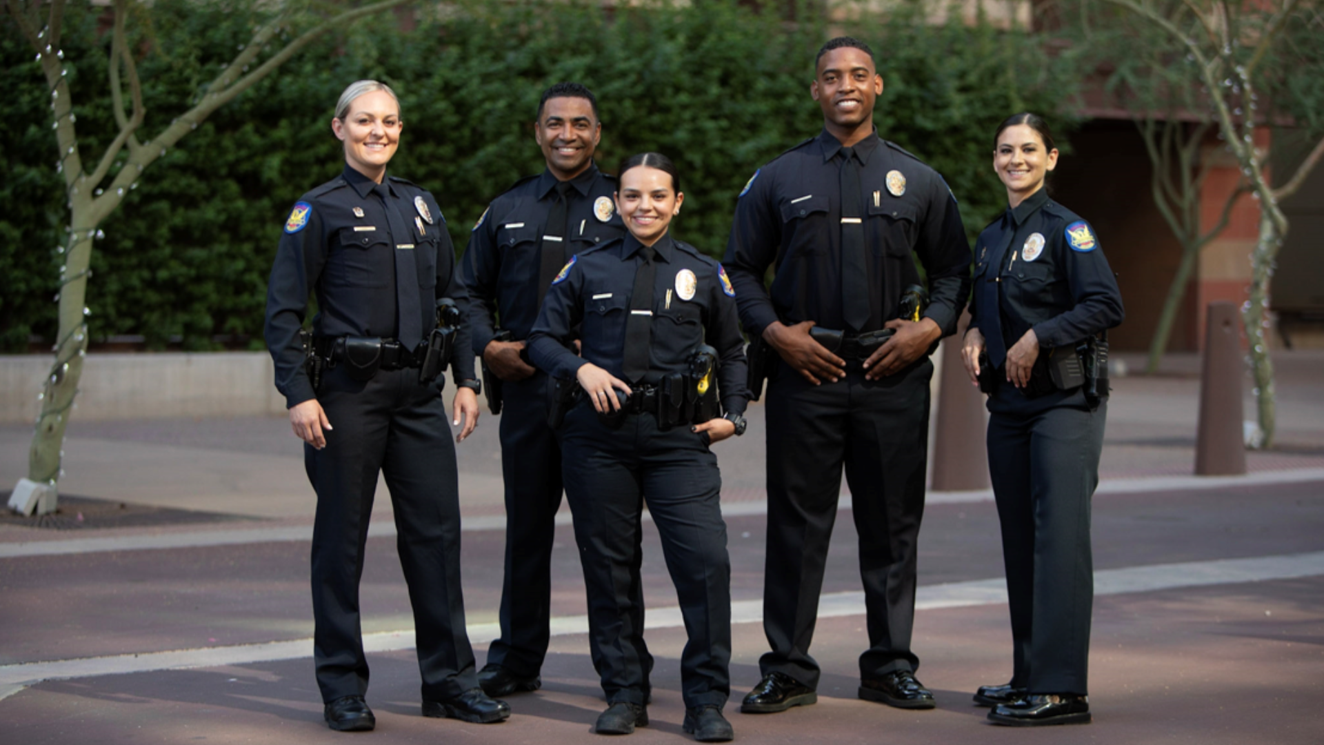 Five Phoenix Police officers standing in uniform