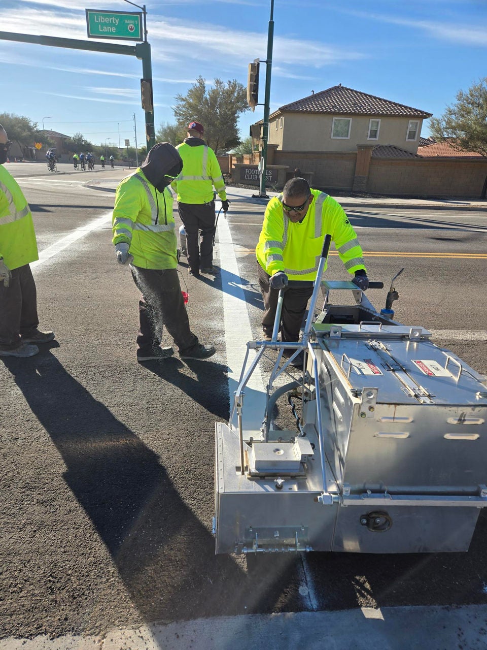 Striping crews in roadway