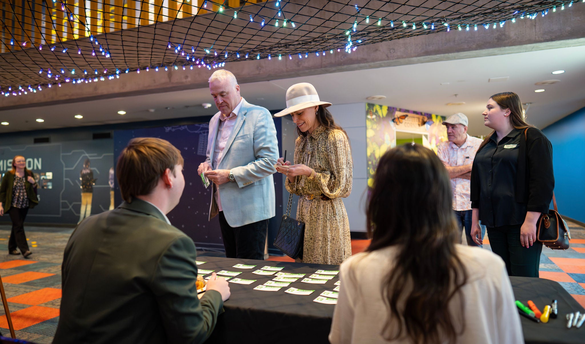 Guests check in at the entrance of the event