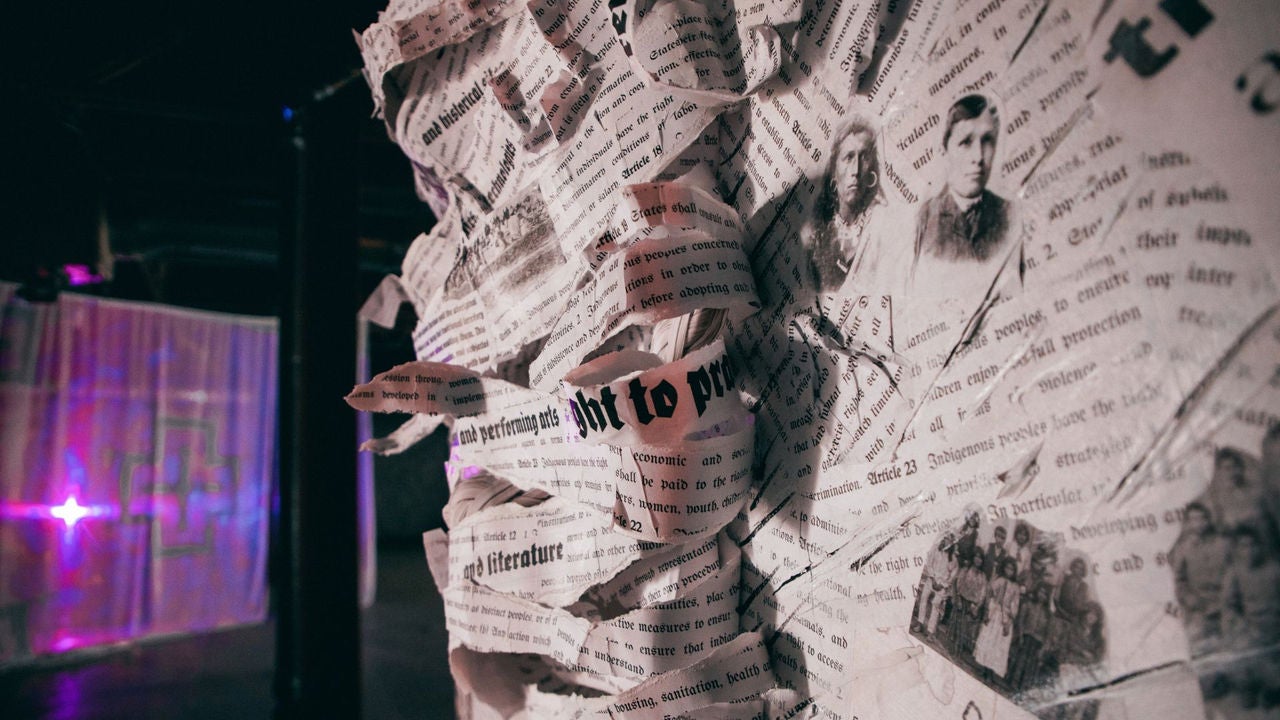 Photo of mixed media newspaper based immersive art installation by Eunique Yazzie, a part of the Roots We Water exhibit by Cahokia PHX.