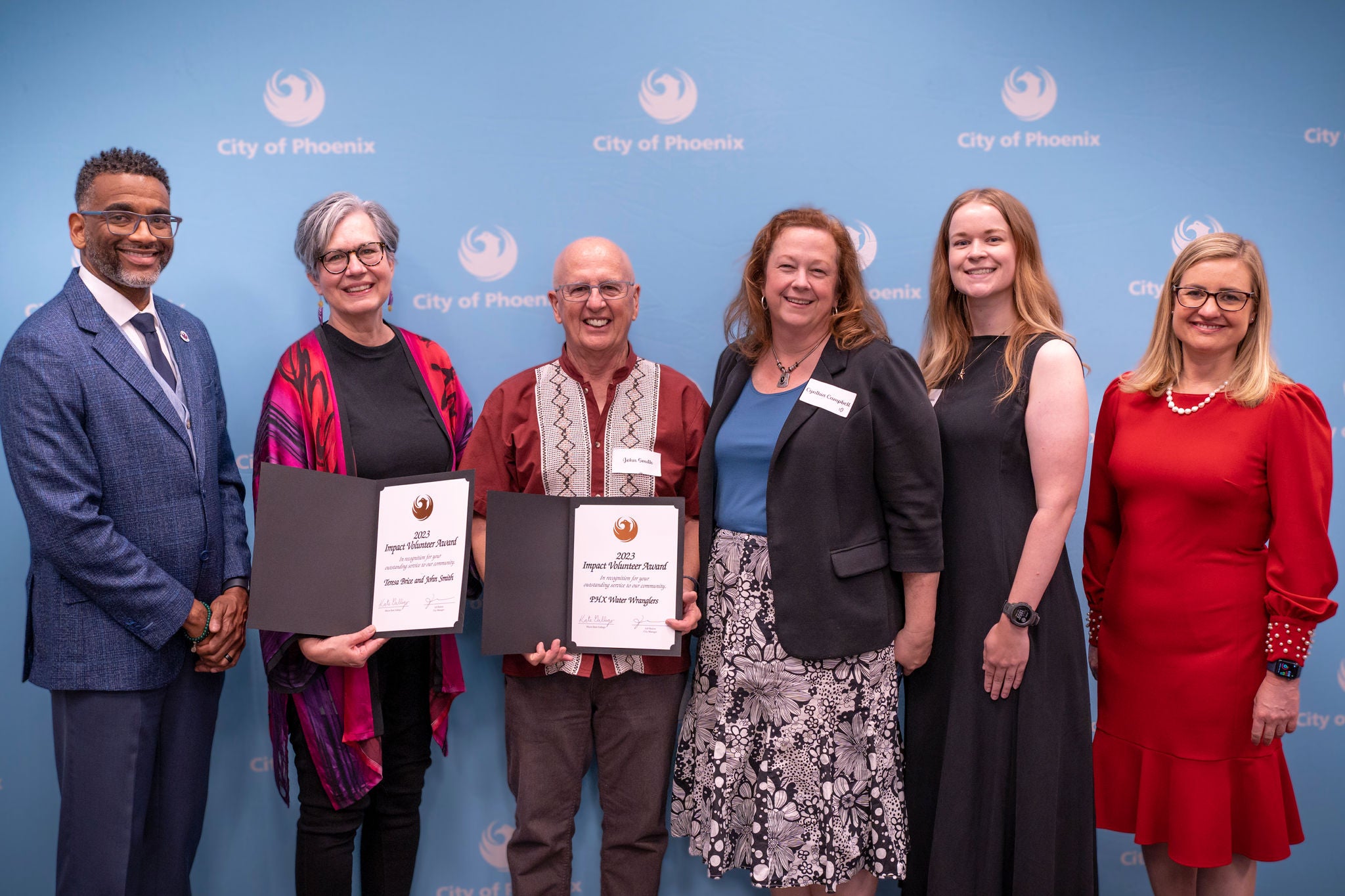 Winners posing for 2023 Impact Volunteer awards