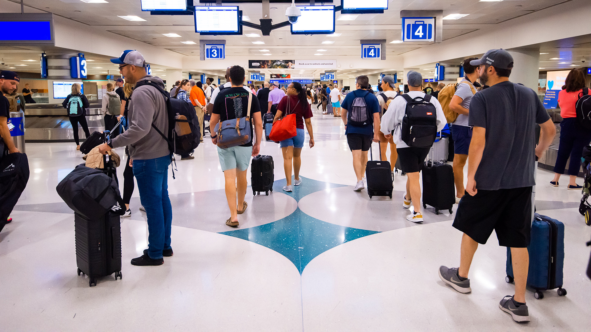 Passenger traffic at Phoenix Sky Harbor International Airport Terminal 4 baggage claim.