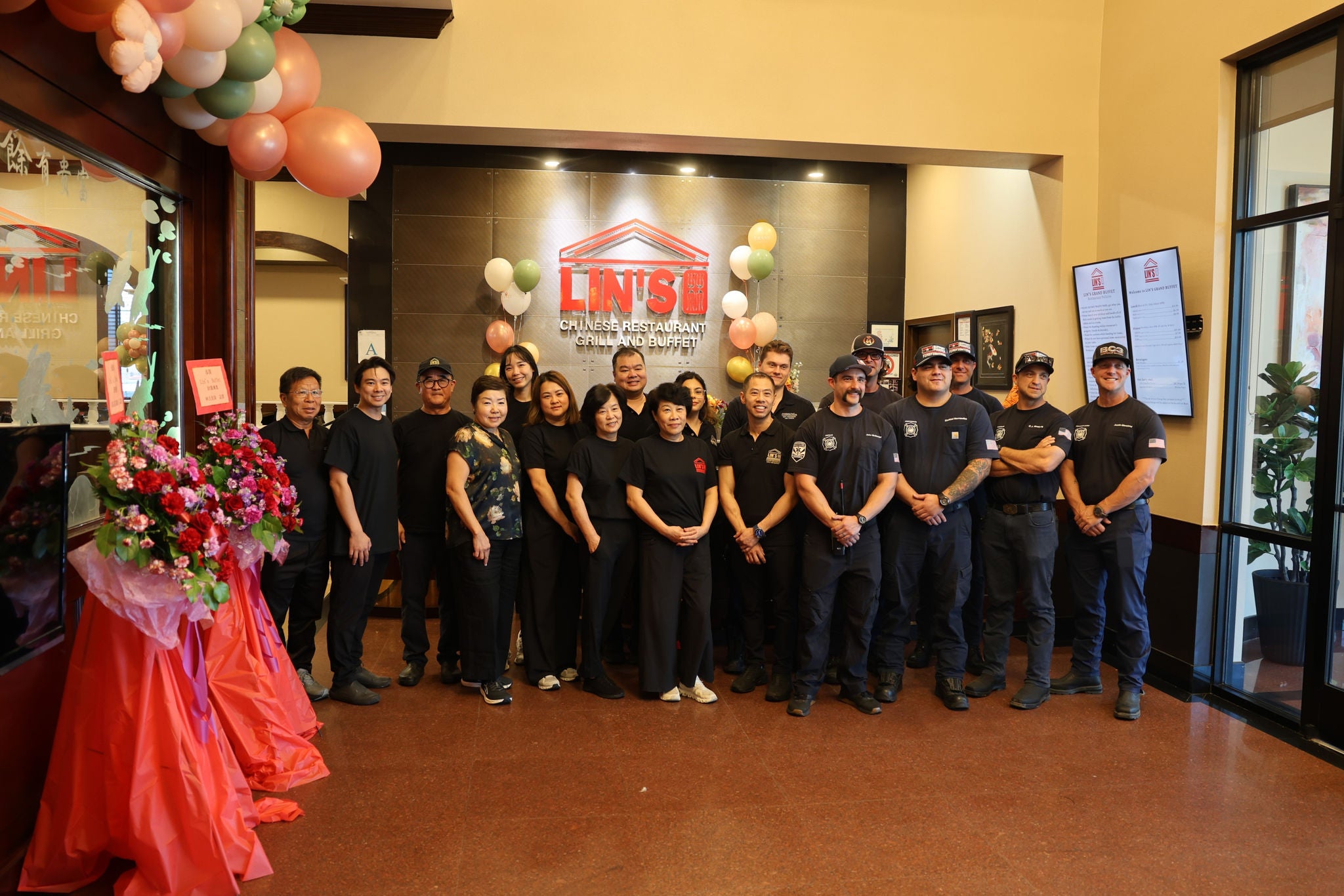 Group photo of Phoenix Fire Figthers and restaurant employees