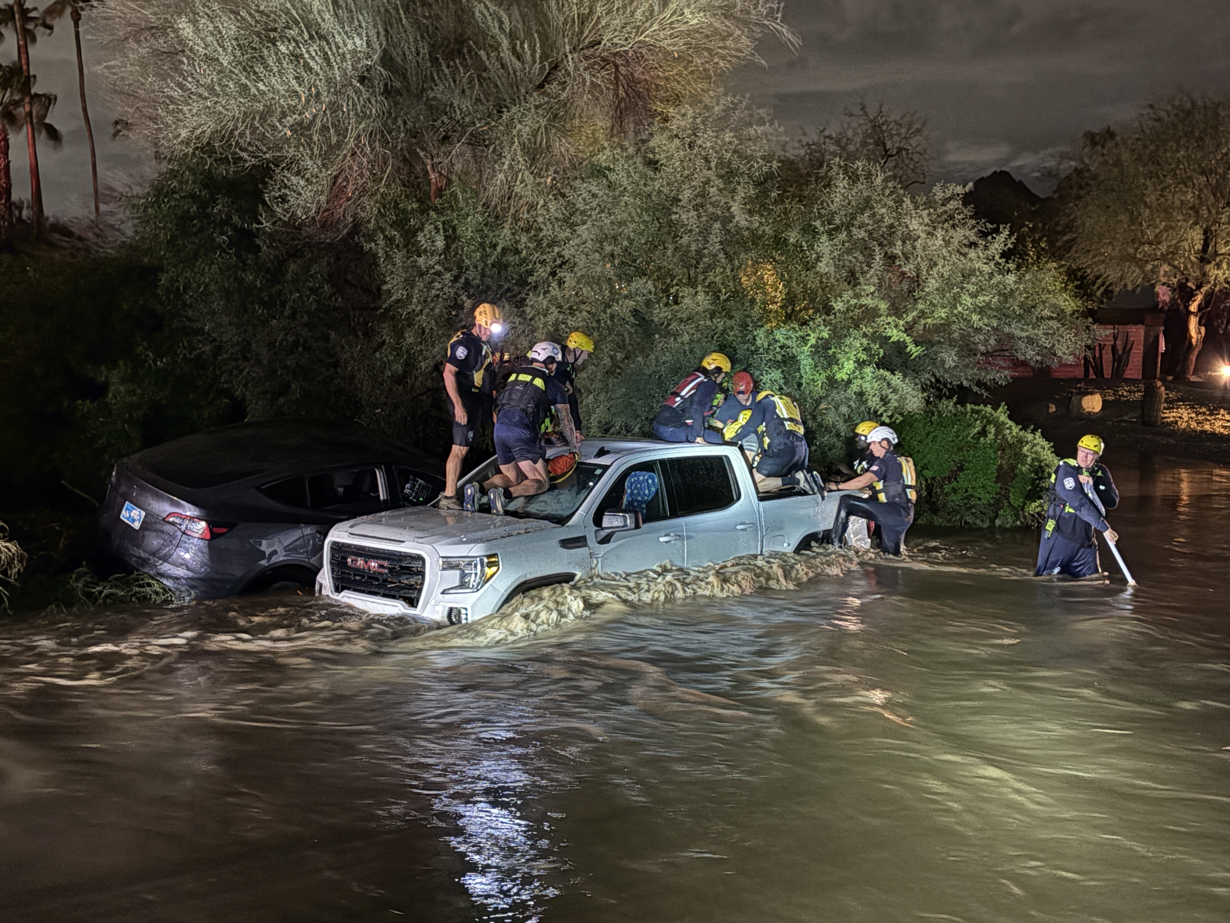 Phoenix Fire conducts water rescue in flooded roadway.
