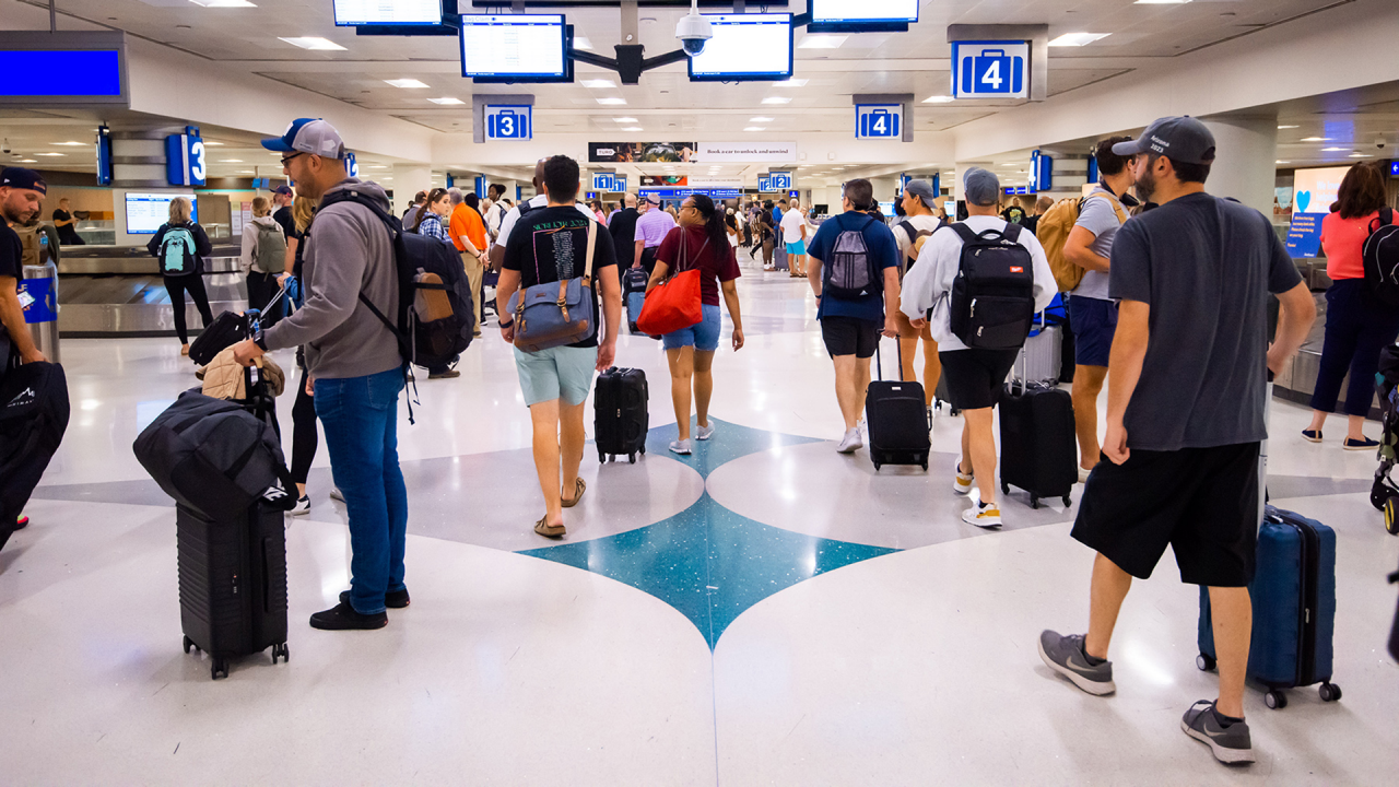 Passenger traffic at Phoenix Sky Harbor International Airport Terminal 4 baggage claim.