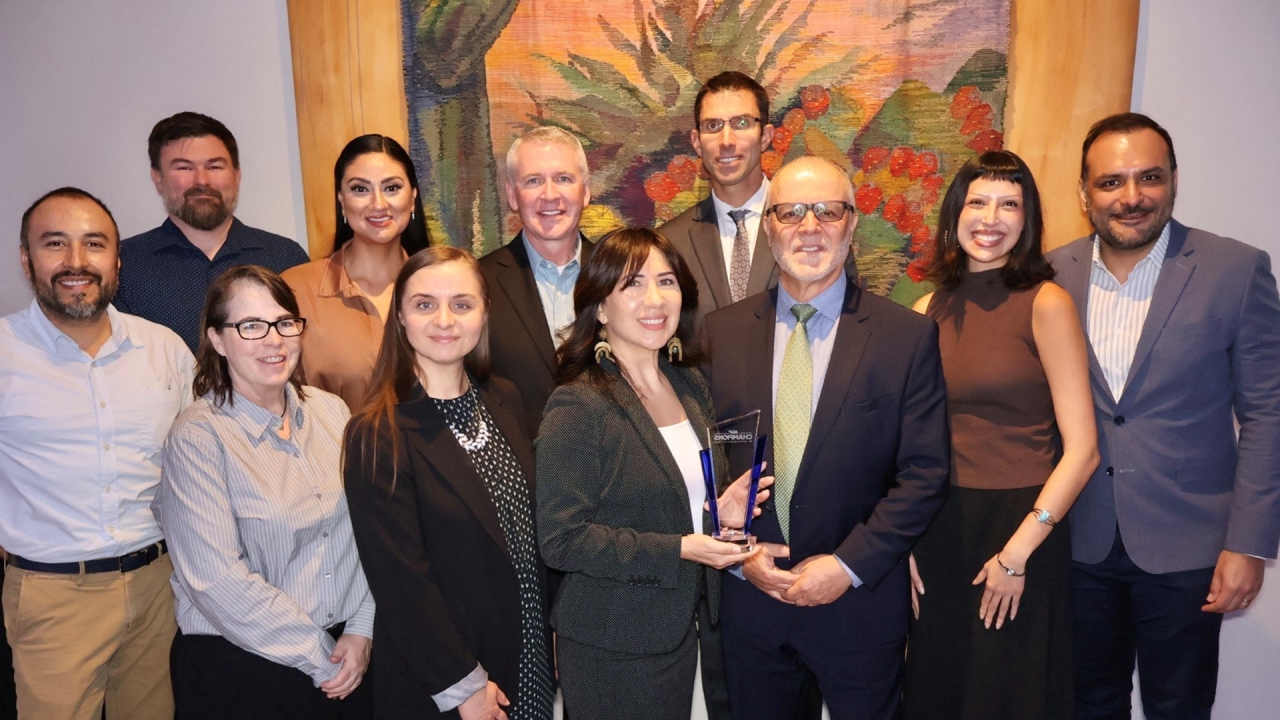 Group of people receiving award office of sustainability and public works