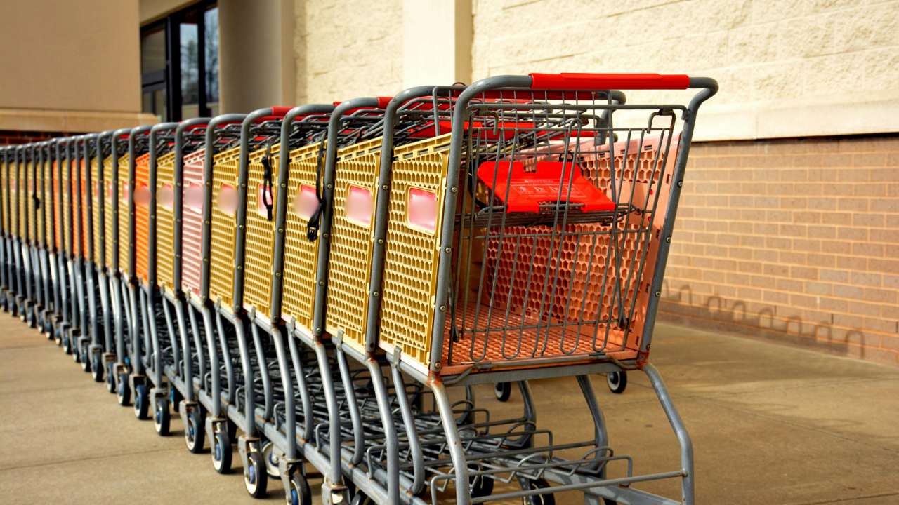 shopping carts lined up outside of a retail store