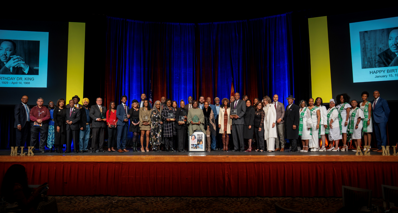 Group photo of the 2025 AZMLK Awardees on stage. 