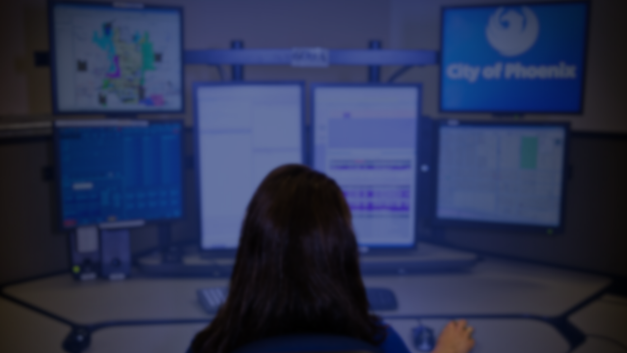 911 operator in front of workstation