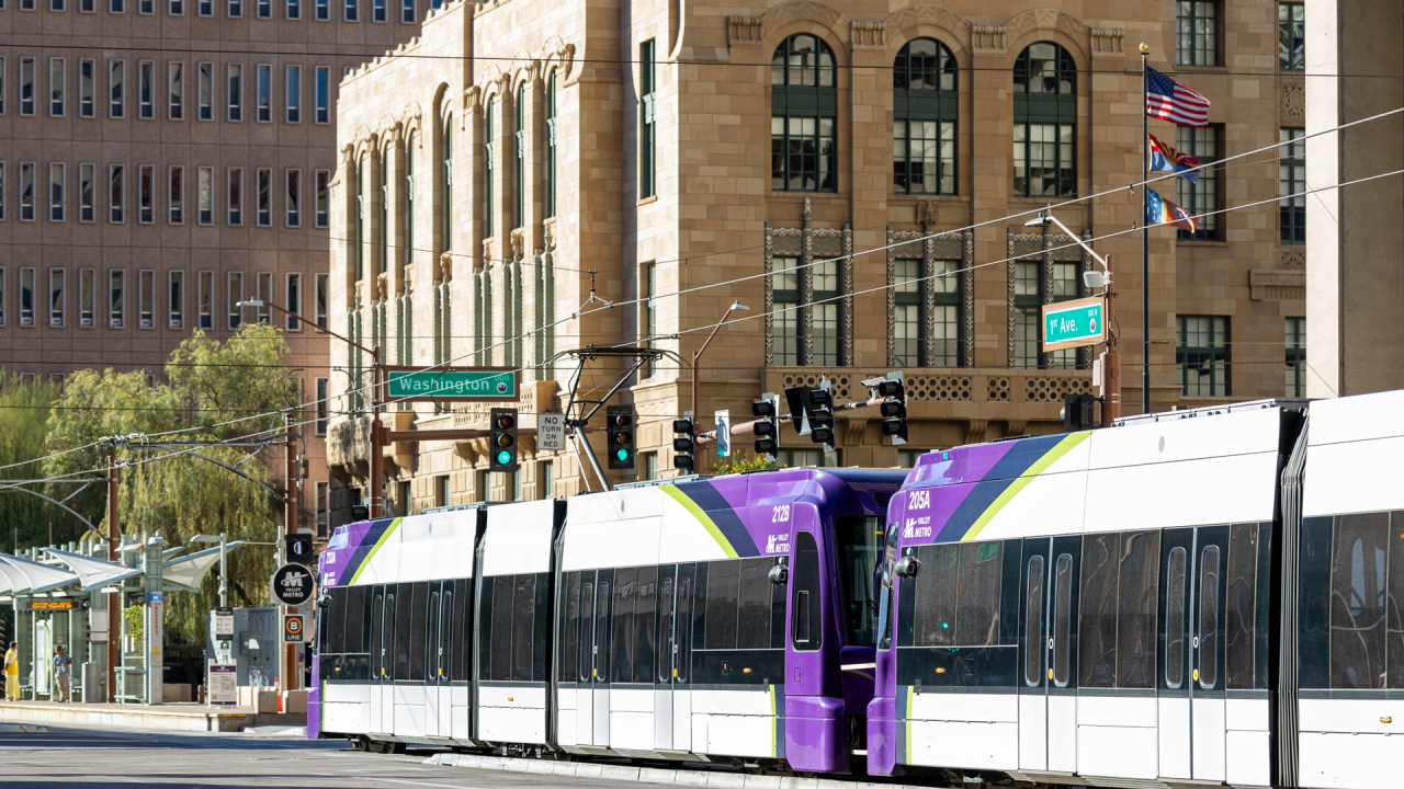 A valley Metro light rail train travelling North on 1st Ave at the intersection with Washington St. in Downtown Phoenix. 