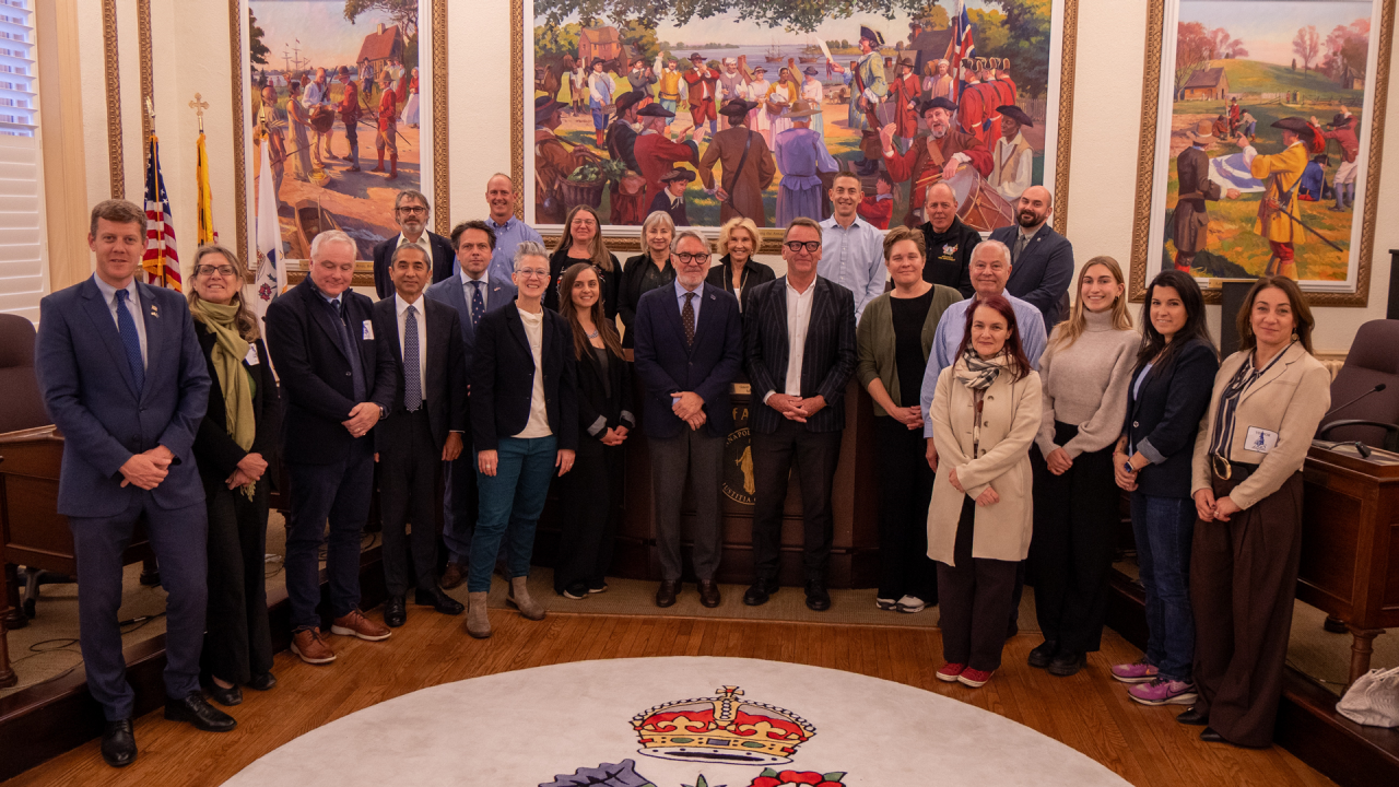 Representatives from various cities in the U.S., Canada, and Europe pose together after their cities were accepted into  acceptance into the prestigious European Union Cities Gateway North America Program.