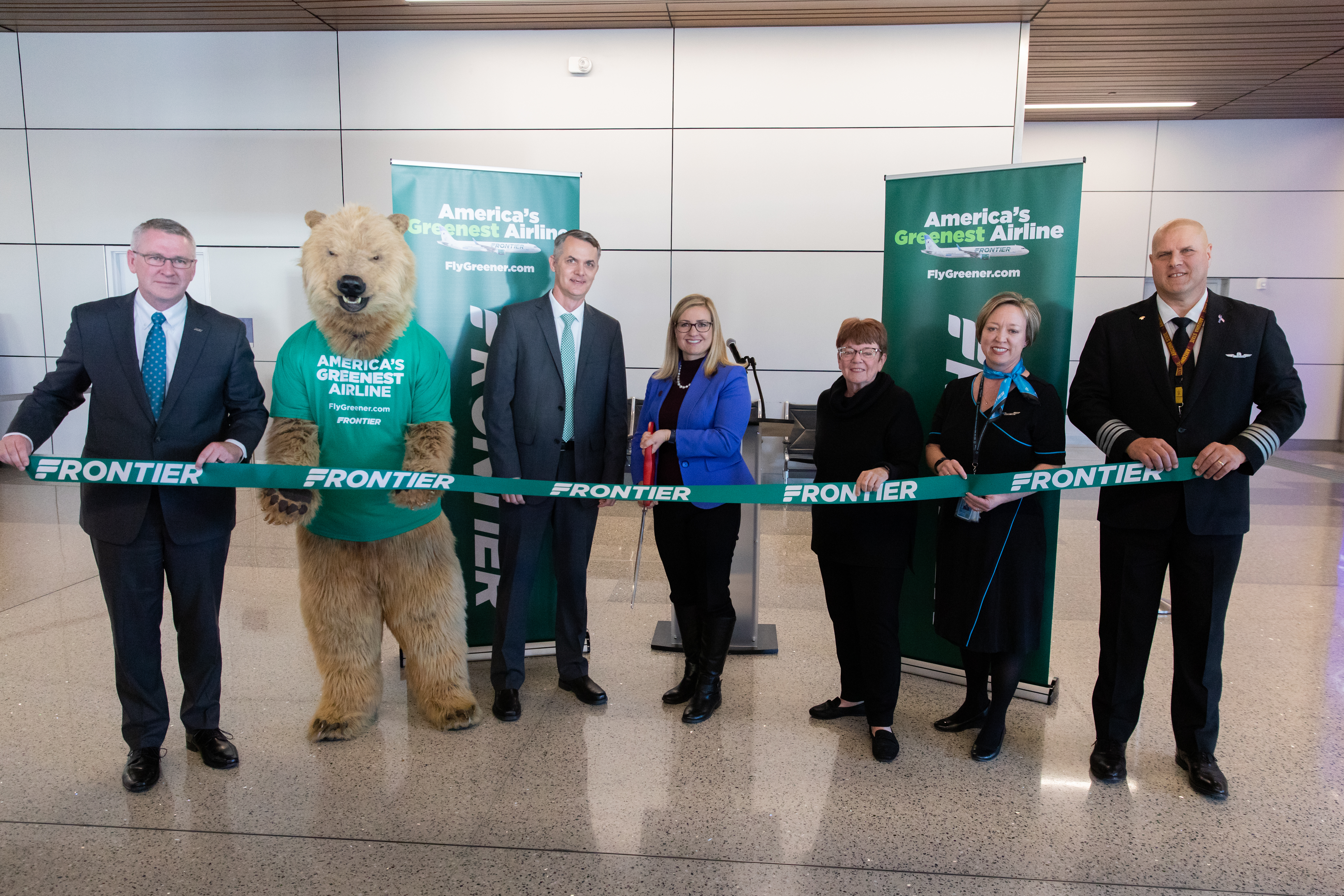 Phoenix Mayor Kate Gallego joined by Aviation Department executives and Frontier Airline executive to cut ceremonial ribbon.