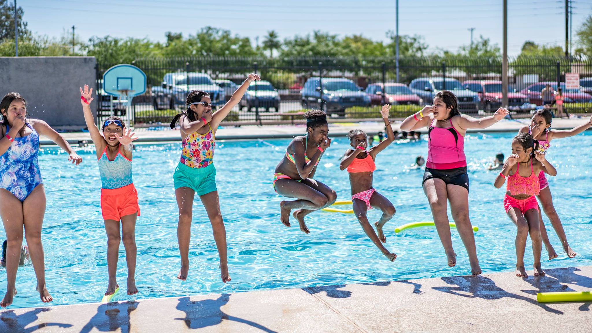 Line of kids jumping in pool.jpg