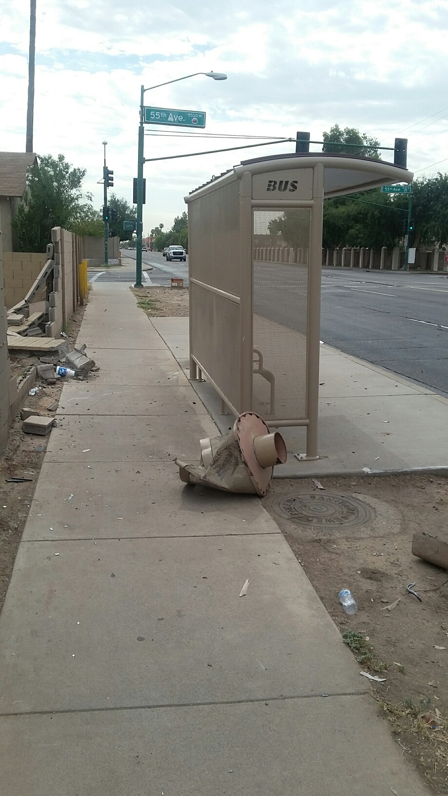 Bus shelter damage (trashcan).jpg