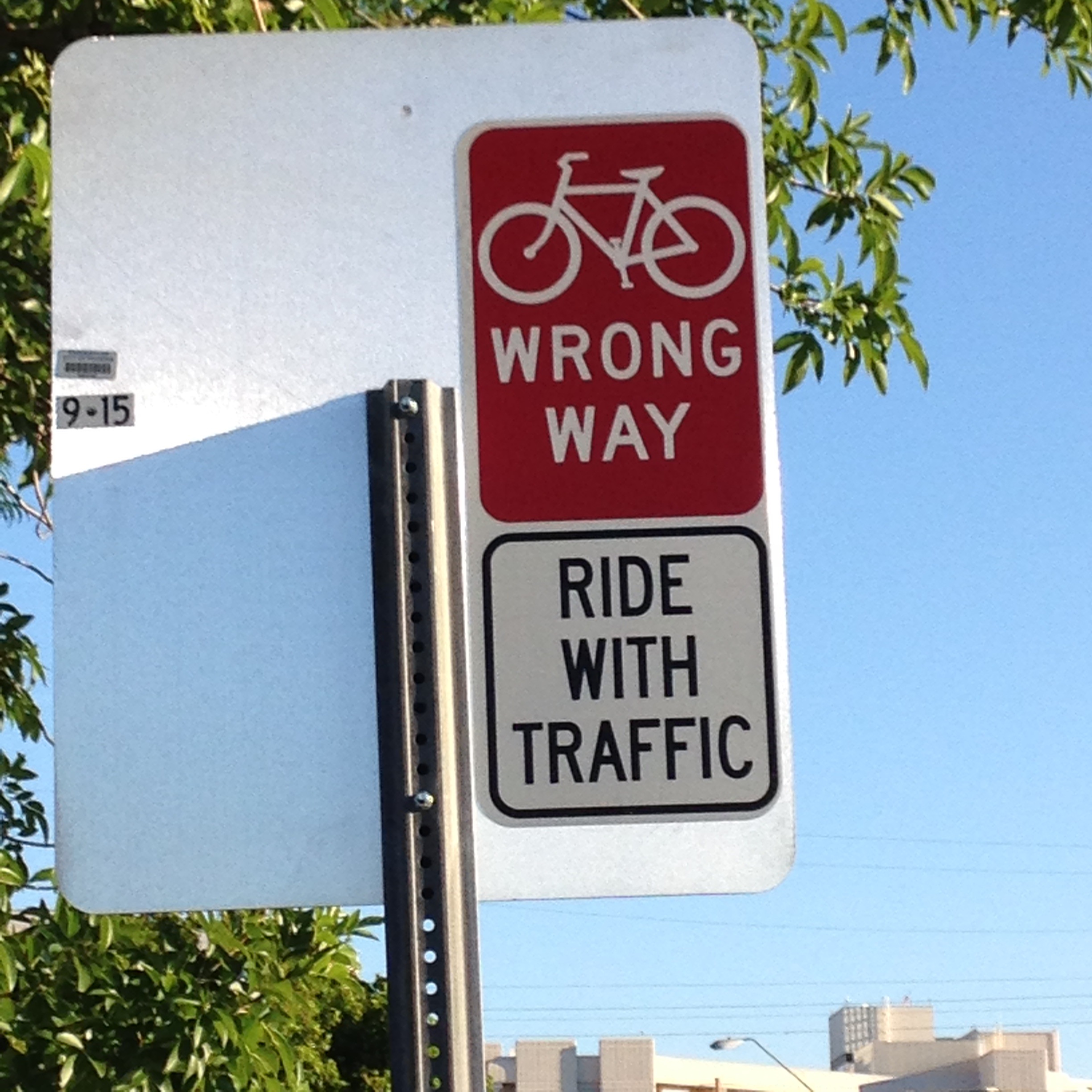 Wrong way bike sign, says Ride with Traffic